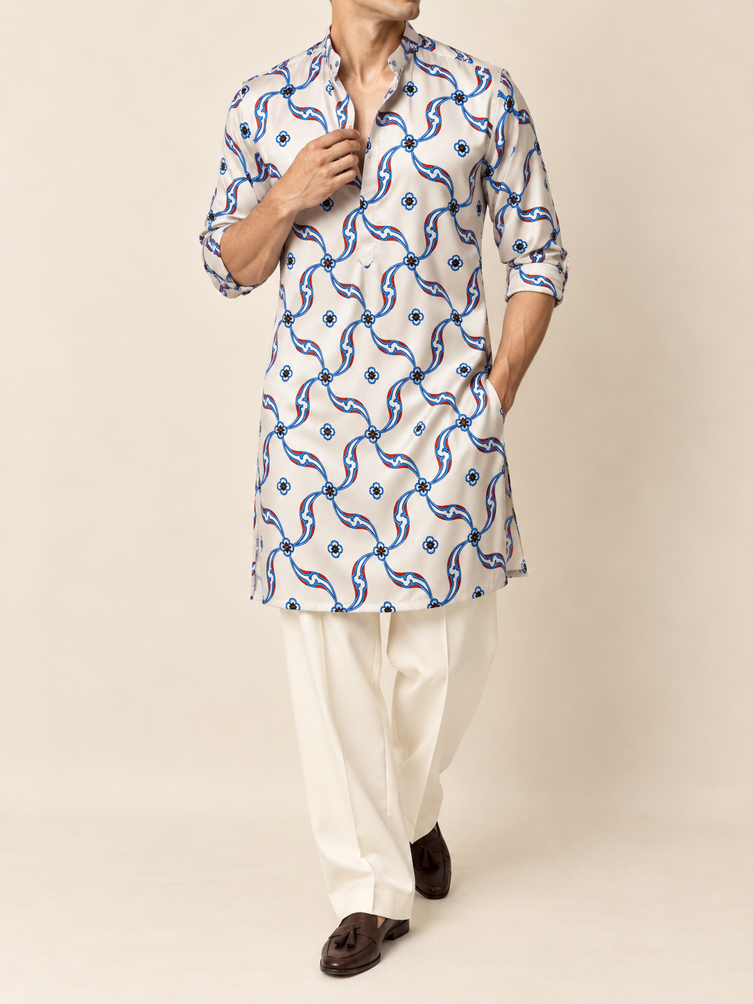 Close-up of white Japanese satin kurta with blue and red printed motif and hand embroidery