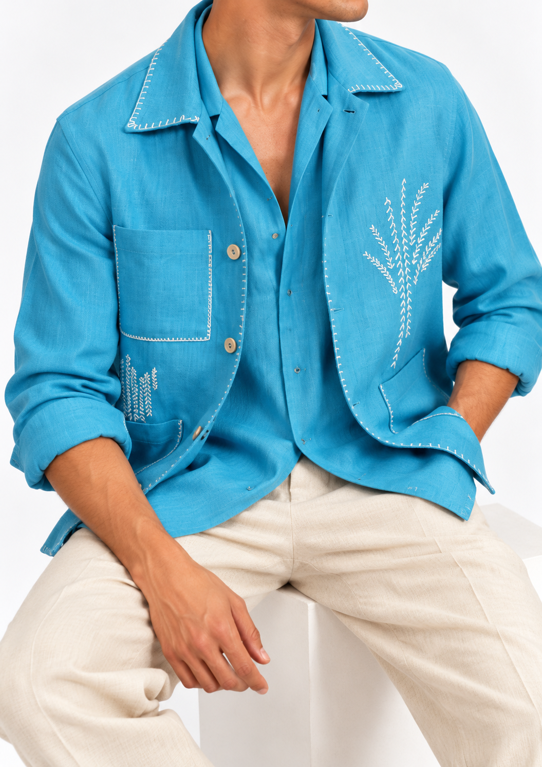 Close-up of electric blue embroidered linen shacket