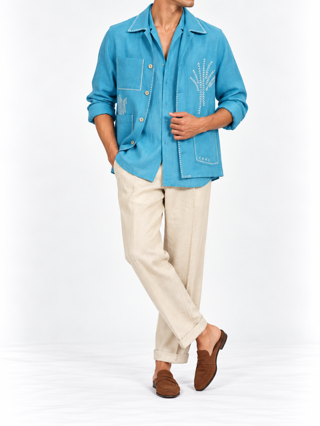 Electric blue embroidered linen shacket worn by model