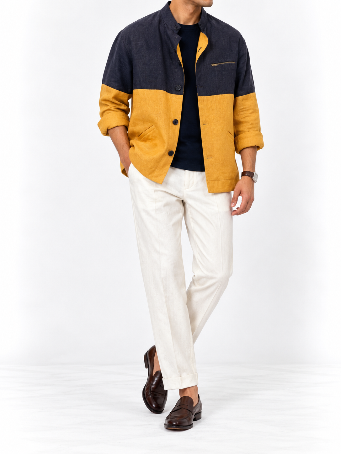 Mustard and navy linen colour-block shacket worn with white linen trousers