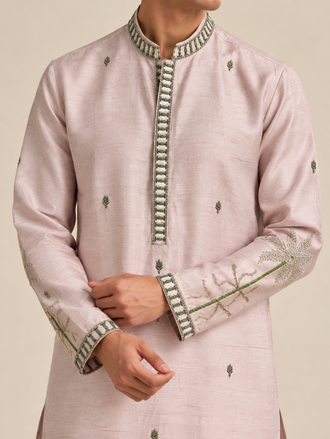 Close-up of hand embroidery on blush silk kurta